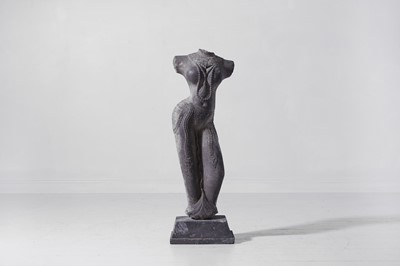 Lot 221 - A carved schist female attendant figure