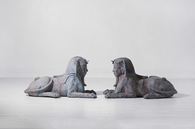 Lot 581 - A pair of patinated metal sphinxes