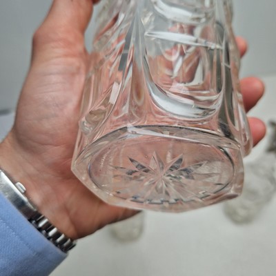 Lot 49 - A set of three silver-mounted cut-glass decanters