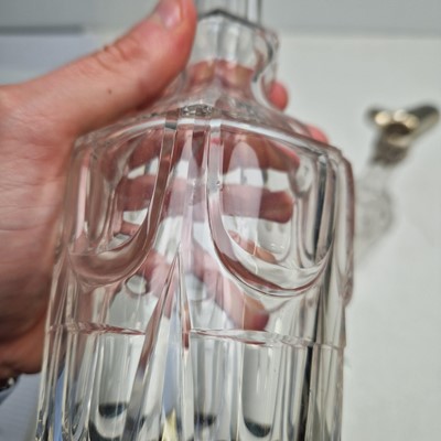 Lot 49 - A set of three silver-mounted cut-glass decanters
