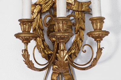 Lot 475 - A pair of gilt-composition three-branch wall lights
