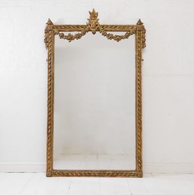 Lot 279 - A Louis XVI-style carved giltwood and gesso mirror