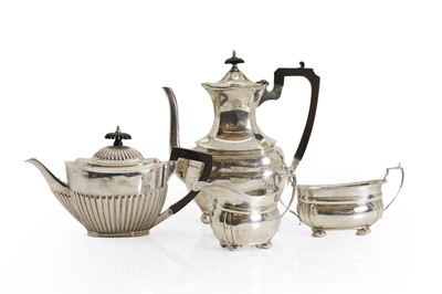 Lot 21 - A harlequin four-piece tea service