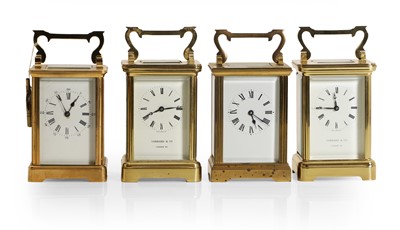 Lot 186 - Four similar brass carriage timepieces