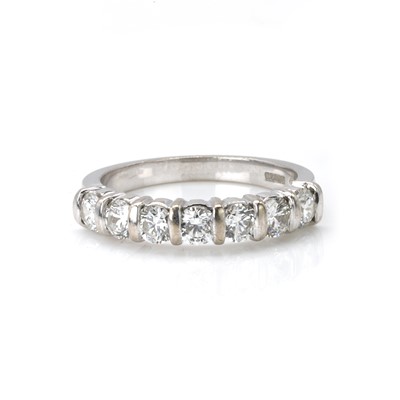 Lot 77 - An 18ct white gold diamond half eternity ring