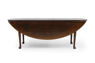 Lot 363 - A George II style oak dining table