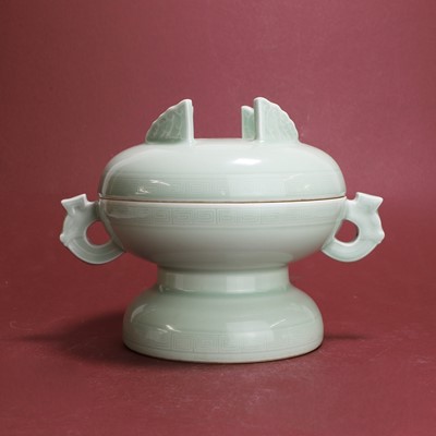 Lot 37 - A Chinese celadon-glazed dou and cover