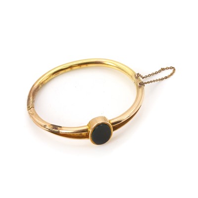 Lot 15 - A gold bloodstone set hinged bangle