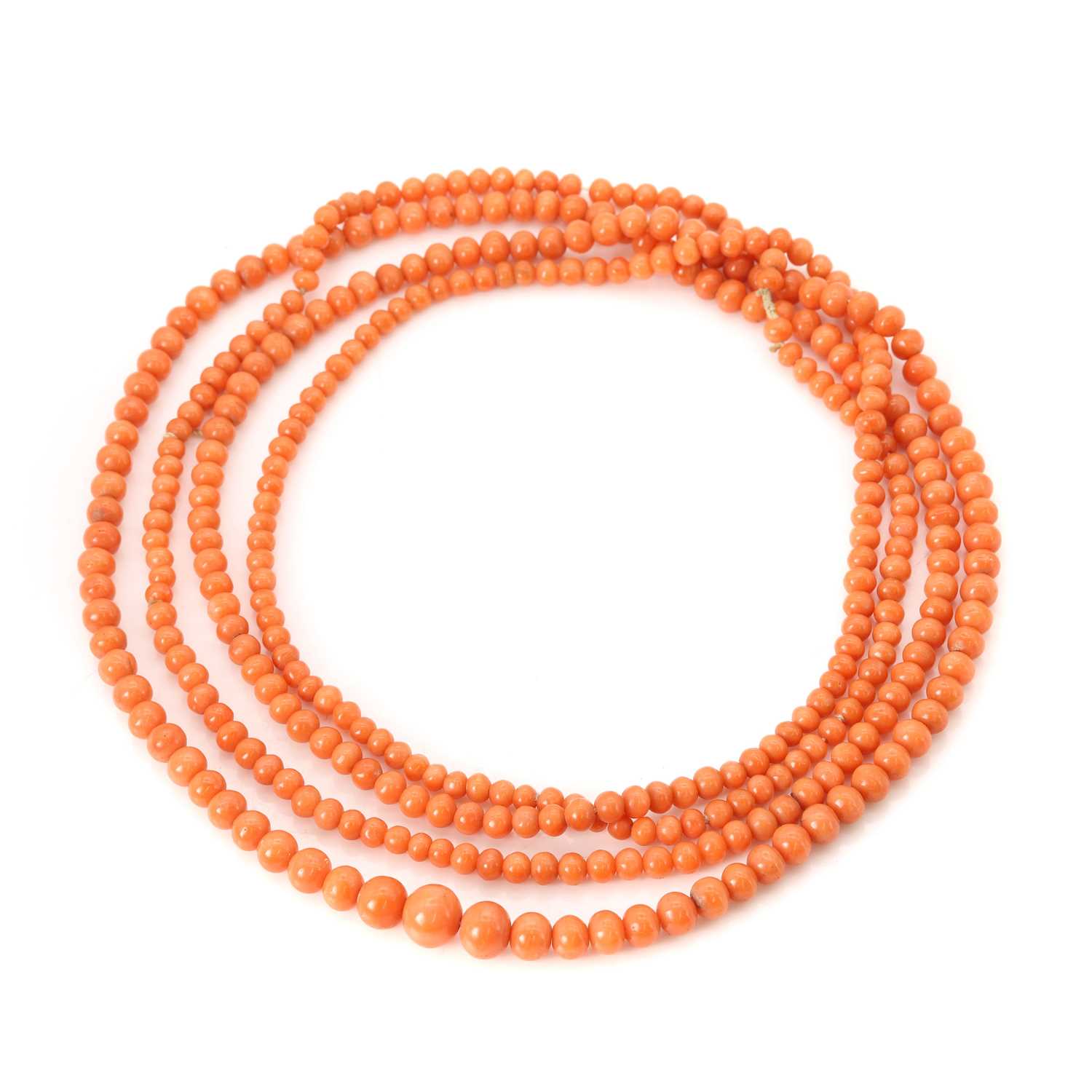 Lot 123 - A long strand of graduated red coral beads,
