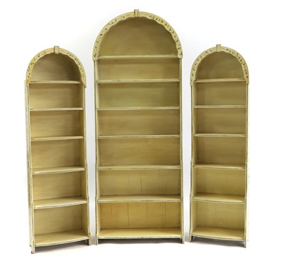 Lot 339 - A set of three painted dome top waterfall bookcases