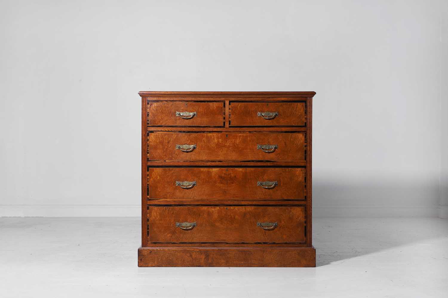 Lot 242 - A brown oak and coromandel chest of drawers
