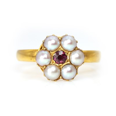 Lot 20 - A ruby and split pearl cluster ring