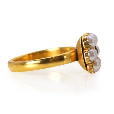 Lot 20 - A ruby and split pearl cluster ring