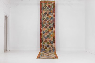Lot 418 - A flat-weave wool runner of Anatolian design
