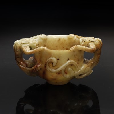 Lot 101 - A Chinese jade two-handled cup