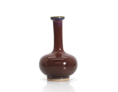 Lot 99A - A Chinese copper red-glazed vase