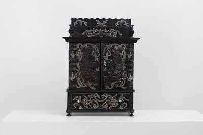 Lot 104 - An Anglo-Indian ebony and ivory-inlaid table cabinet