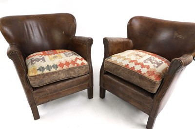 Lot 466 - A pair of leather and kilim upholstered armchairs
