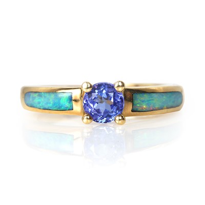 Lot 146 - A tanzanite and opal inlay ring