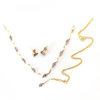 Lot 183 - A sapphire bracelet, earrings and pendant set