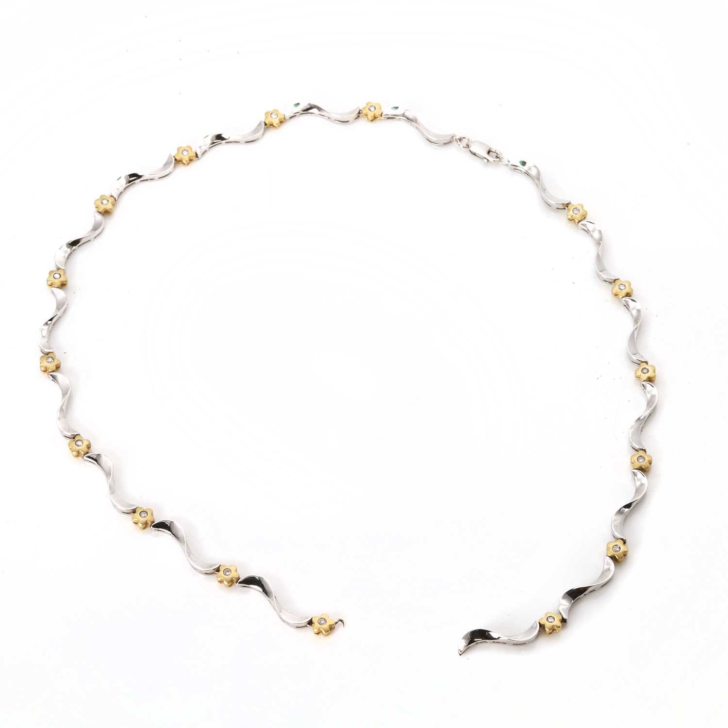 Lot 153 - A white and yellow gold diamond floral necklace