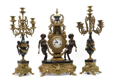 Lot 257 - A Neoclassical style gilt metal mantle clock and garniture