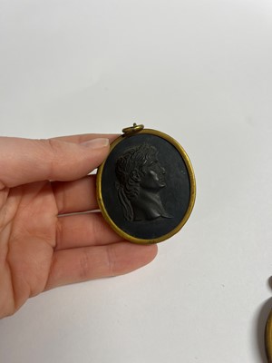 Lot 167 - A set of twelve Wedgwood black basalt medallions