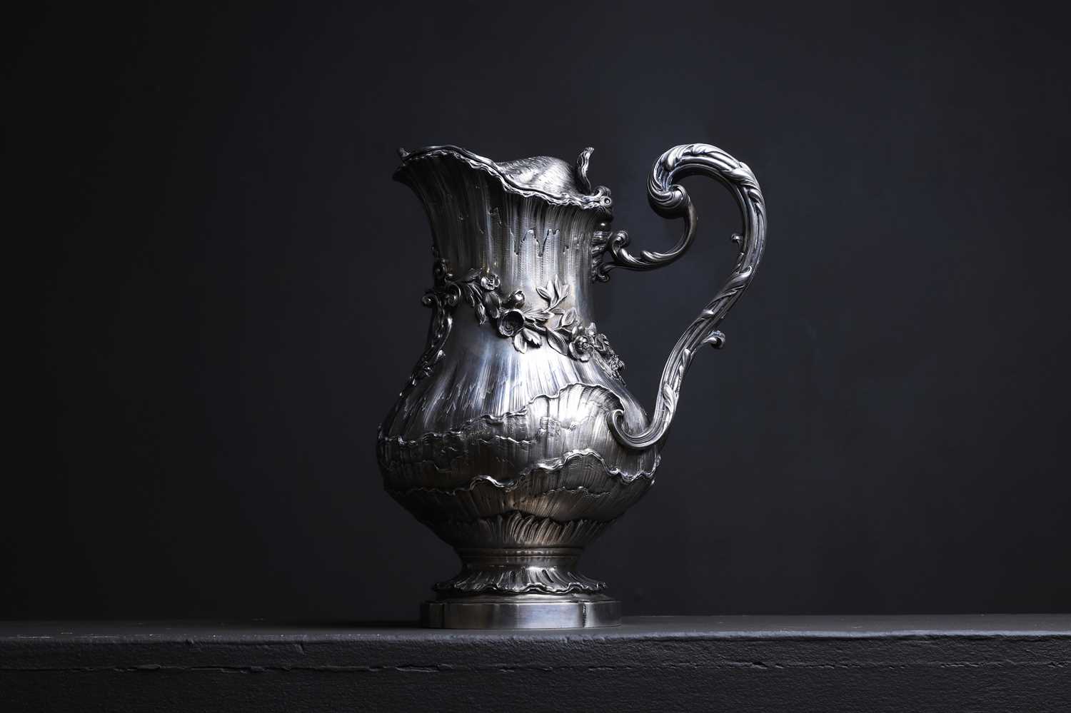 Lot 303 - A Louis XV-style silver claret jug