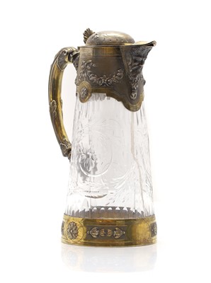 Lot 39 - A silver and silver gilt mounted water jug