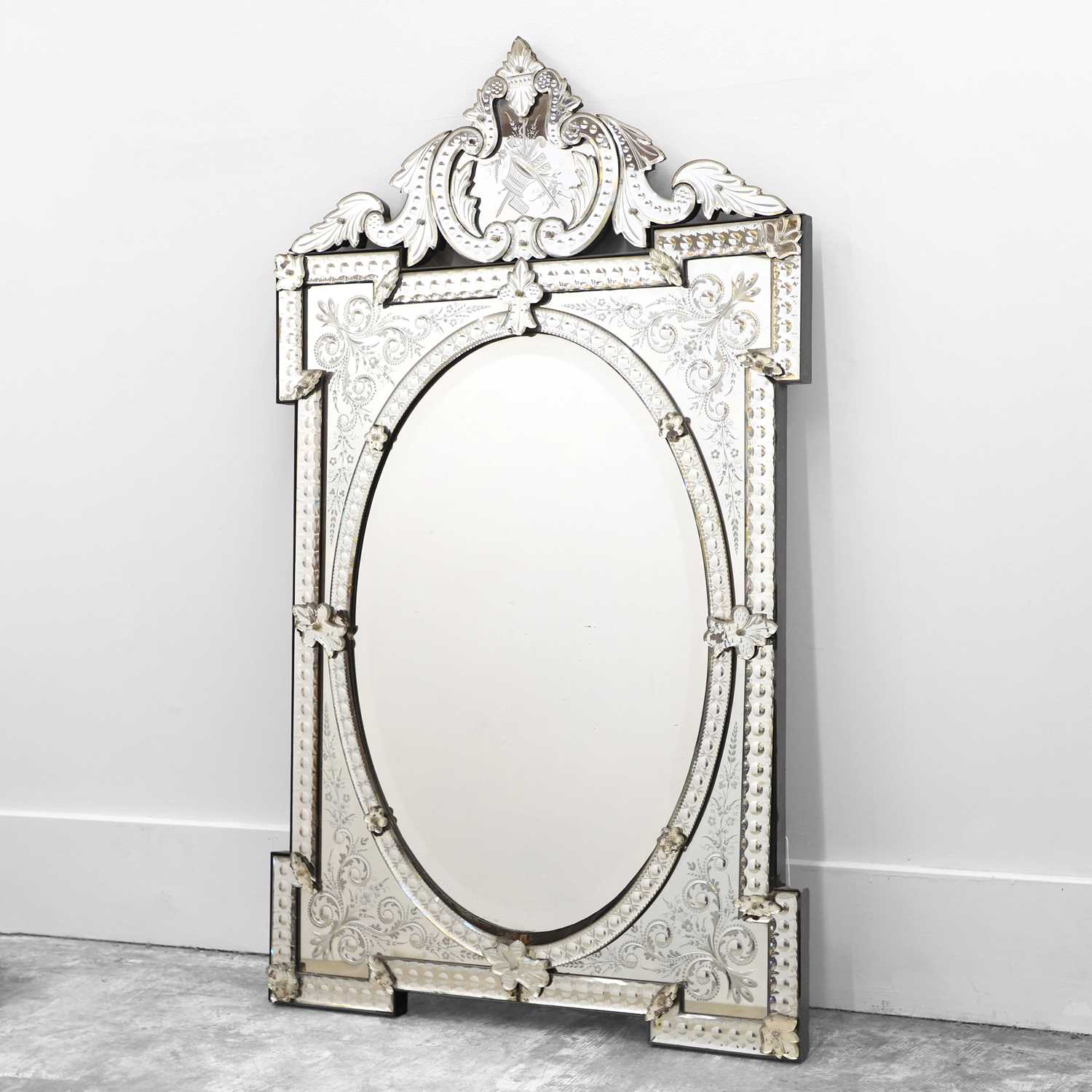 Lot 491 - A Venetian wall mirror