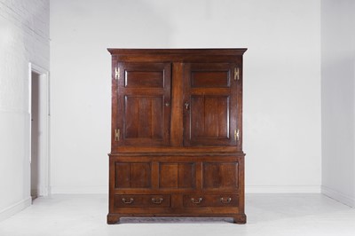 Lot 99 - A George III oak press cupboard