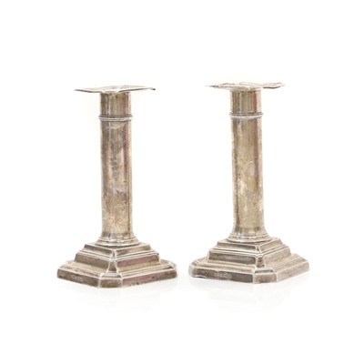 Lot 8 - A pair of silver candlesticks