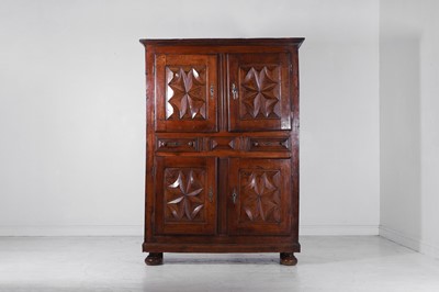 Lot 206 - A carved walnut cupboard