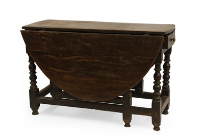 Lot 473 - An oak gateleg table and six Lancashire type chairs
