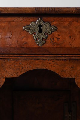 Lot 280 - A small Queen Anne walnut and oak kneehole desk