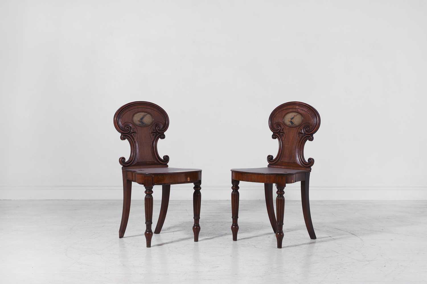 Lot 282 - A pair of Regency mahogany hall chairs