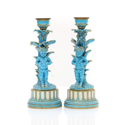 Lot 102 - A pair of Sevres porcelain candlesticks