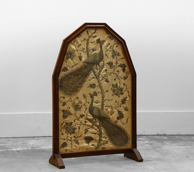 Lot 515 - An oak framed firescreen
