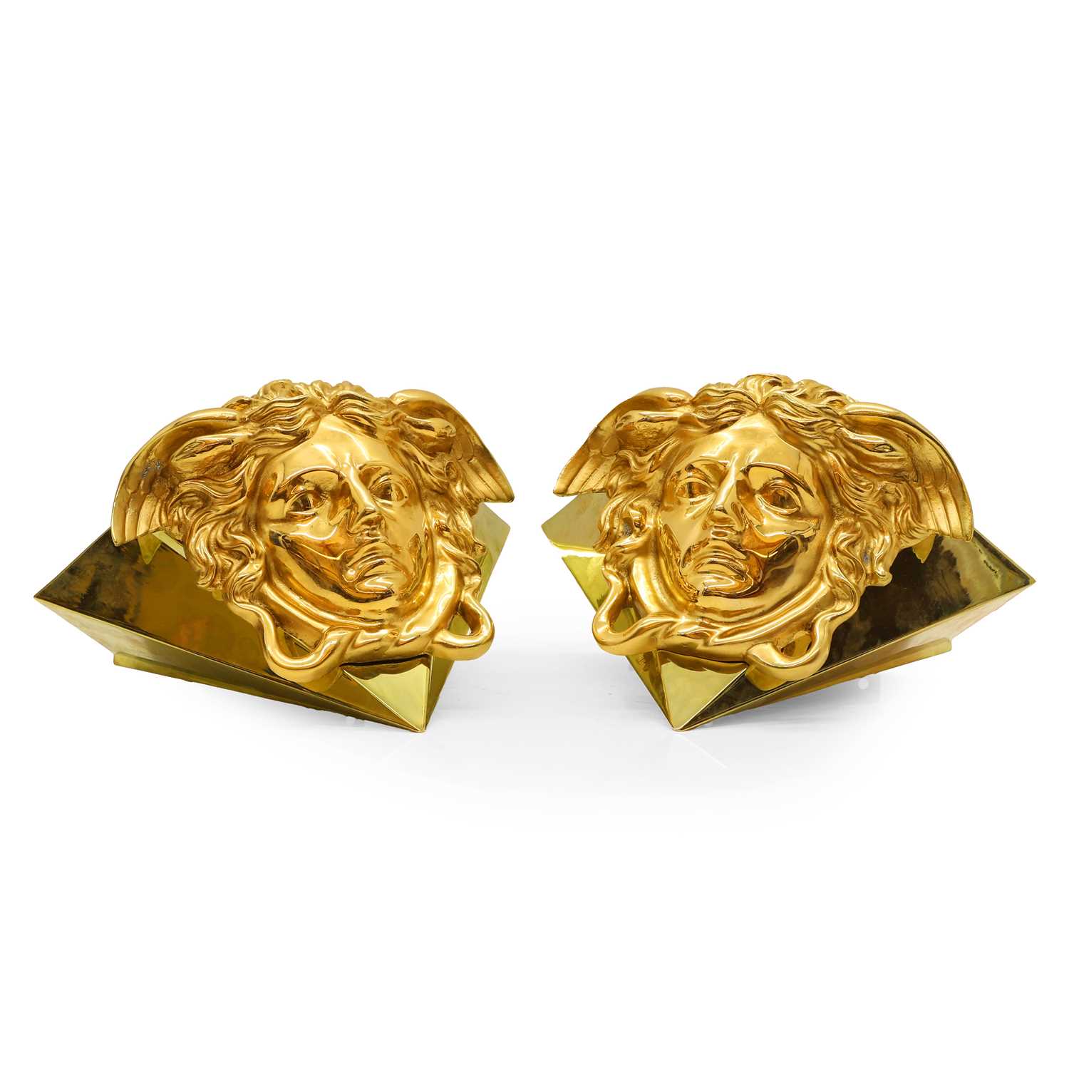 Lot 417 - A pair of Versace Medusa wall lamps