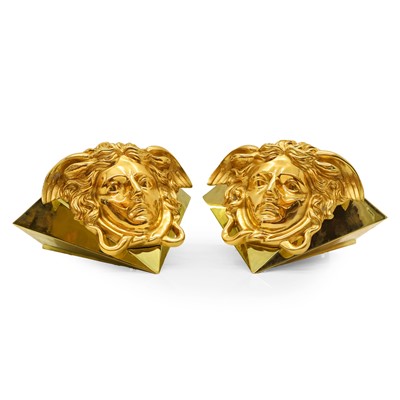 Lot 417 - A pair of Versace Medusa wall lamps