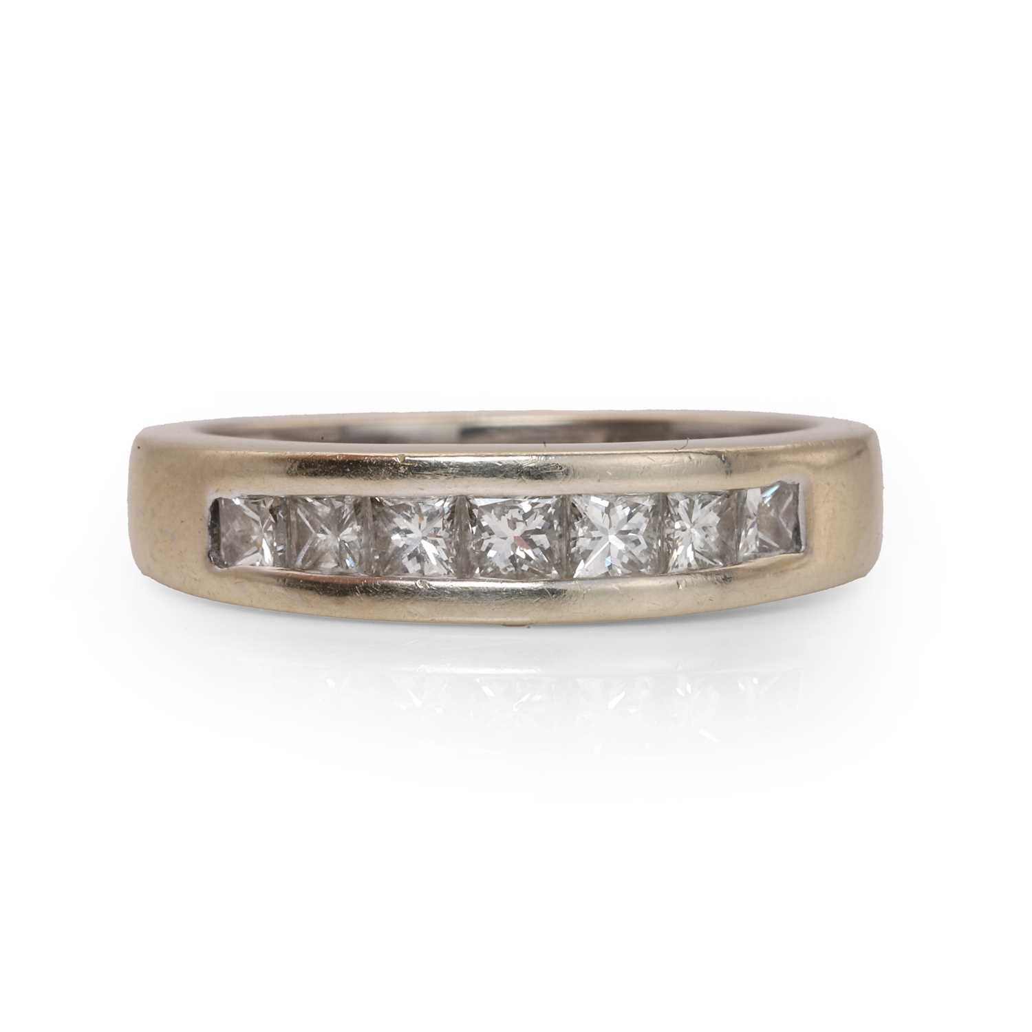 Lot 60 - An 18ct gold diamond half eternity ring