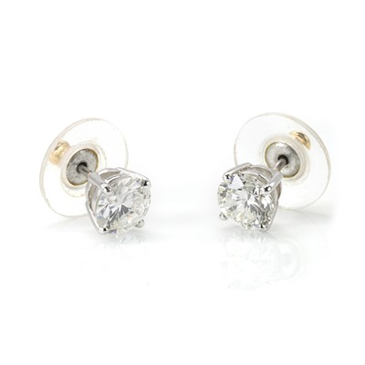 Lot 228 - A pair of diamond single stone stud earrings