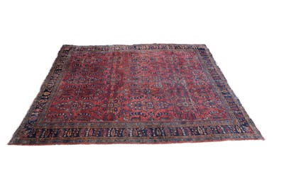 Lot 400 - A red ground Persian rug