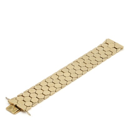 Lot 64 - A 14ct gold strap bracelet, c.1960s