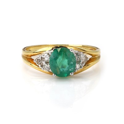 Lot 111 - An 18ct gold emerald and diamond ring