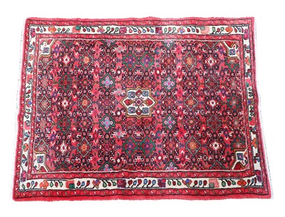 Lot 399 - A red ground Persian rug