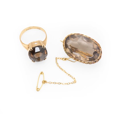 Lot 203 - A smoky quartz ring and a smoky quartz brooch