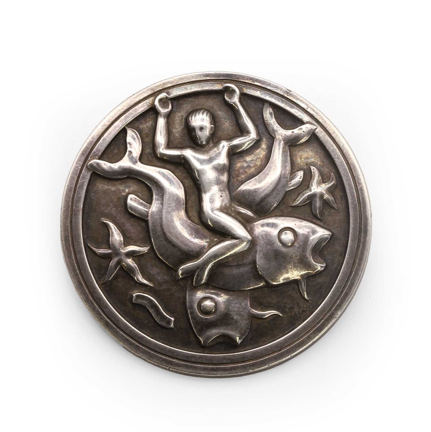 Lot 32 - A silver merman and fish brooch, by Georg Jensen brooch