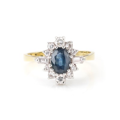 Lot 142 - An 18ct gold sapphire and diamond cluster ring