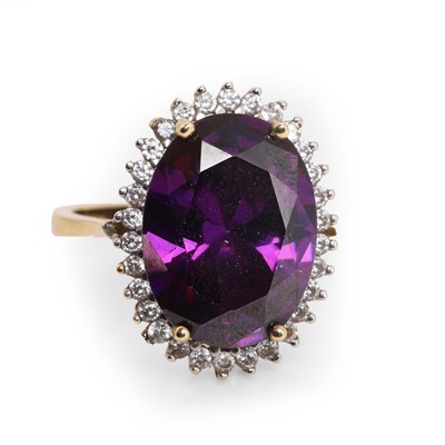 Lot 148 - A purple paste cluster ring